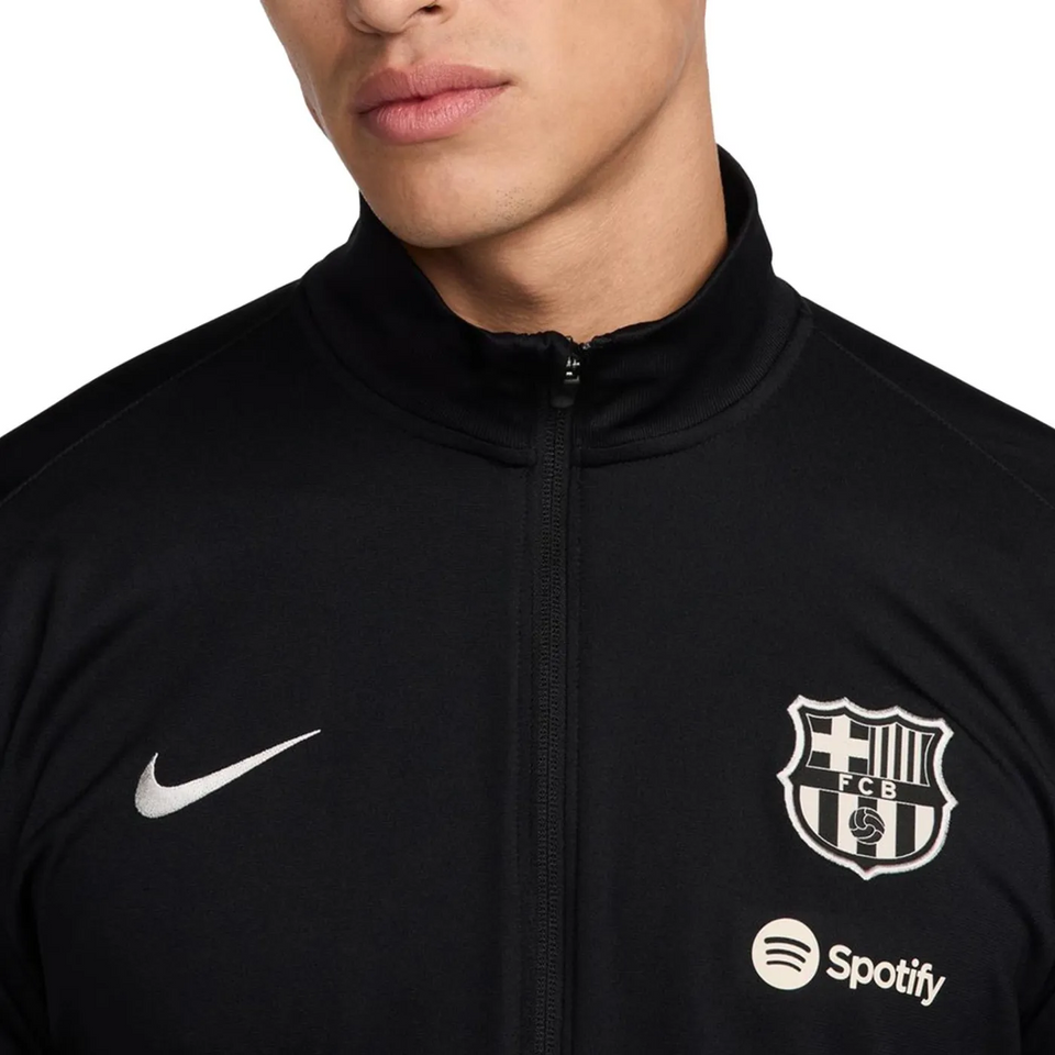 FC Barcelona black tracksuit 2024 25 featuring Nike logo and Spotify emblem on a sleek design