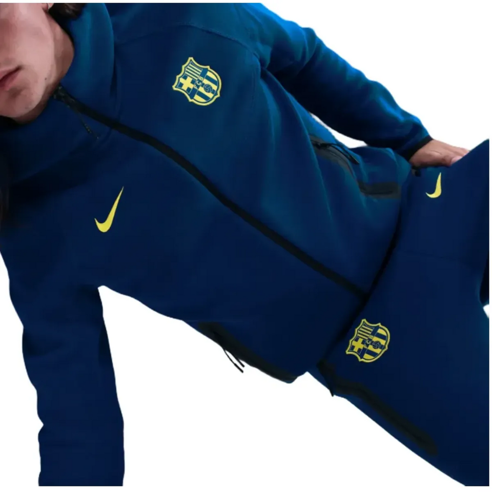 FC Barcelona blue Tech Fleece tracksuit 2026 with zip pockets and logo for stylish comfort
