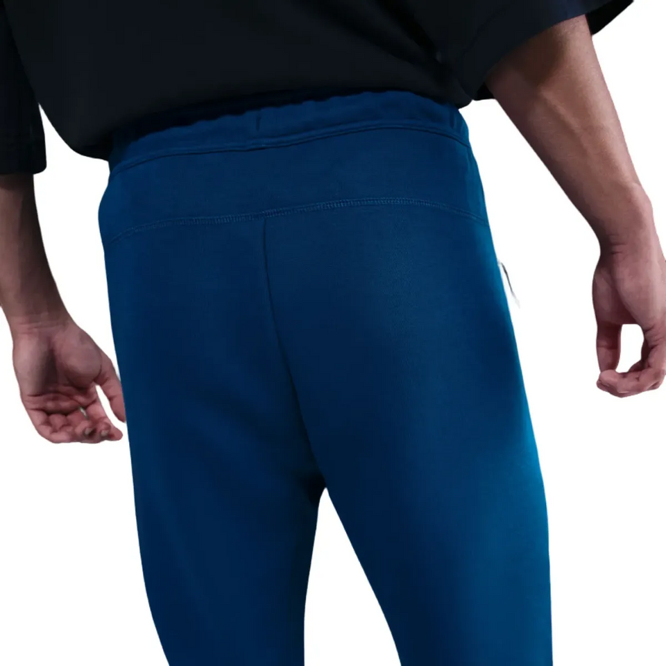 Back view of FC Barcelona blue Tech Fleece tracksuit 2026 featuring a comfortable fit for athletes