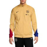 FC Barcelona gold tracksuit 2024 featuring a zip-up jacket and comfortable pants for fans