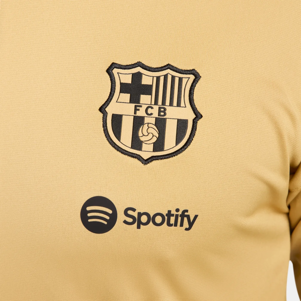 FC Barcelona gold tracksuit 2024 featuring the iconic club logo and Spotify branding