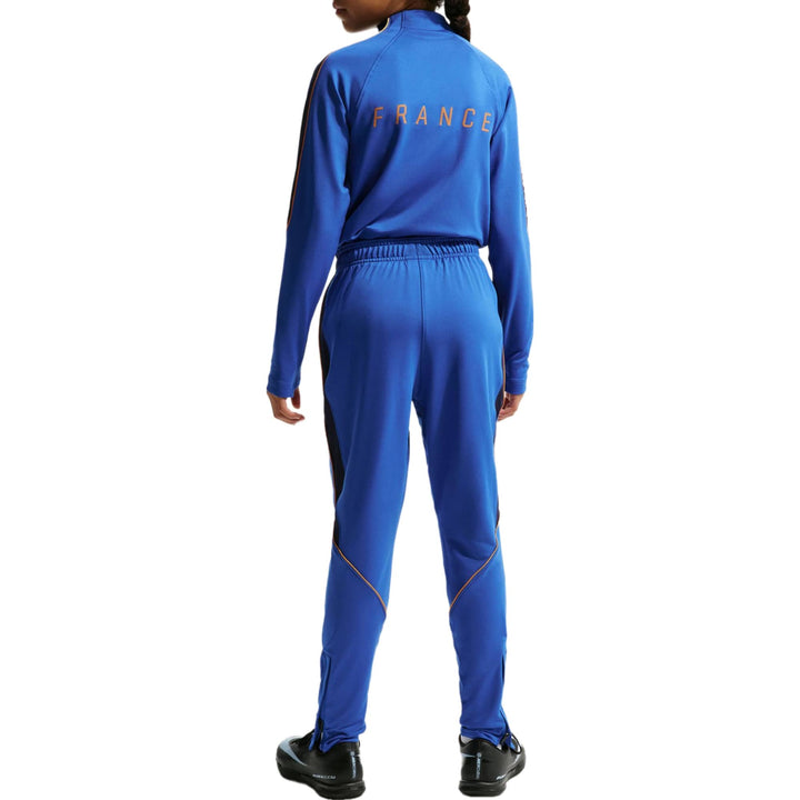 Blue athletic tracksuit in polyester with France lettering on the back and zippered pants