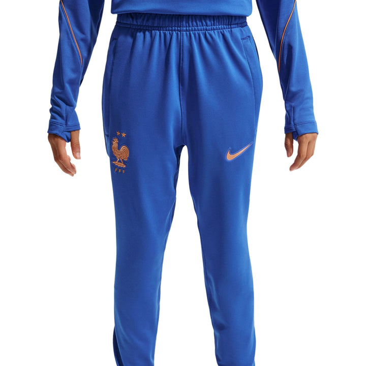 Blue Nike training pants with elastic waistband and embroidered logo