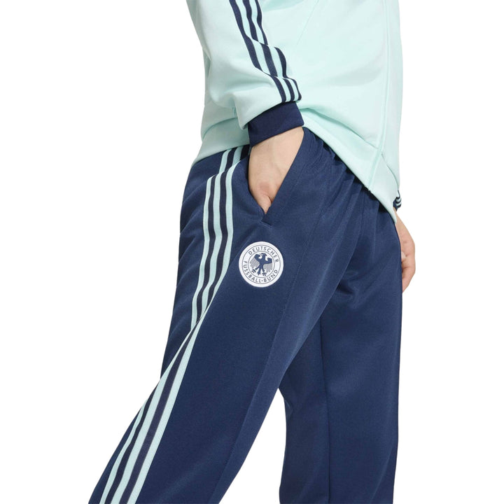 Men's navy blue track pants in polyester with three white stripes and logo detail