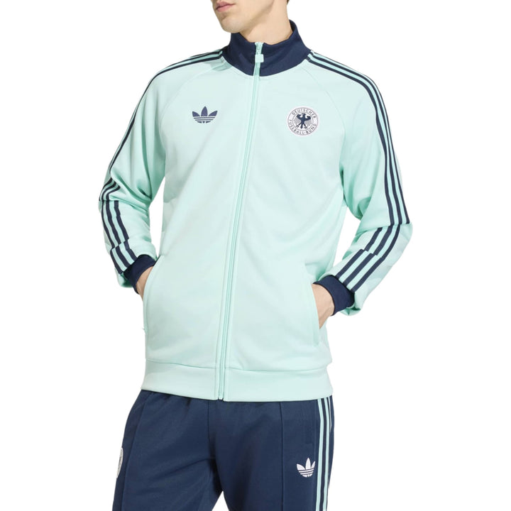 Mint green Adidas track jacket with zip front and three-stripe design on sleeves
