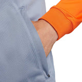 Detail of the Inter Milan grey presentation tracksuit 2023 with a focus on the orange cuff and pocket