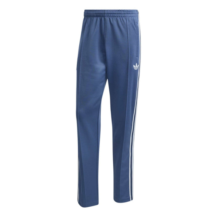 Blue Adidas track pants with white side stripes and elastic waistband