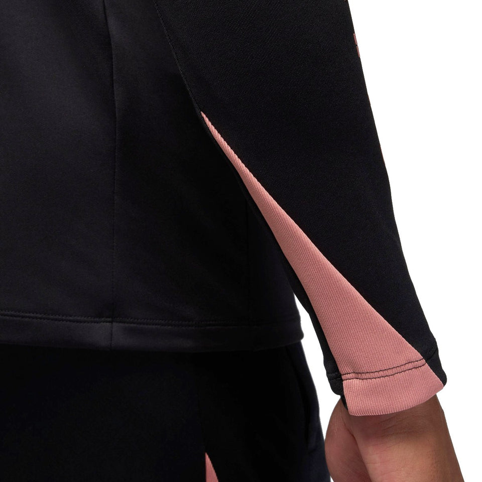 Close-up of the Jordan PSG black training top 2024 featuring stylish pink accents on sleeves