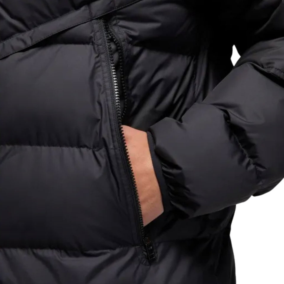 Close-up of the Jordan PSG UCL parka jacket featuring a zip pocket and puffy design for warmth