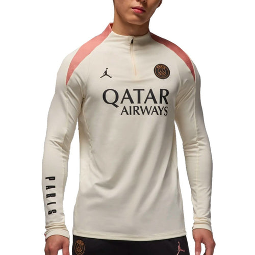 Jordan PSG UCL training top 2024 in cream color with pink accents and Qatar Airways logo