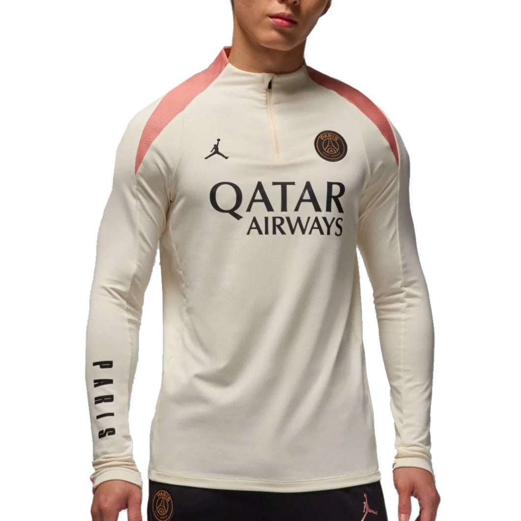Jordan PSG UCL training top 2024 in cream color with pink accents and Qatar Airways logo