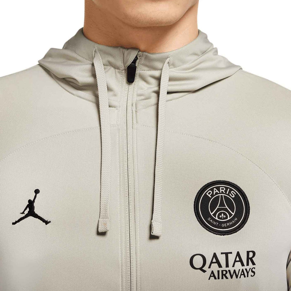 Close-up of Jordan x PSG presentation tracksuit hoodie with Paris Saint-Germain logo and Qatar Airways branding