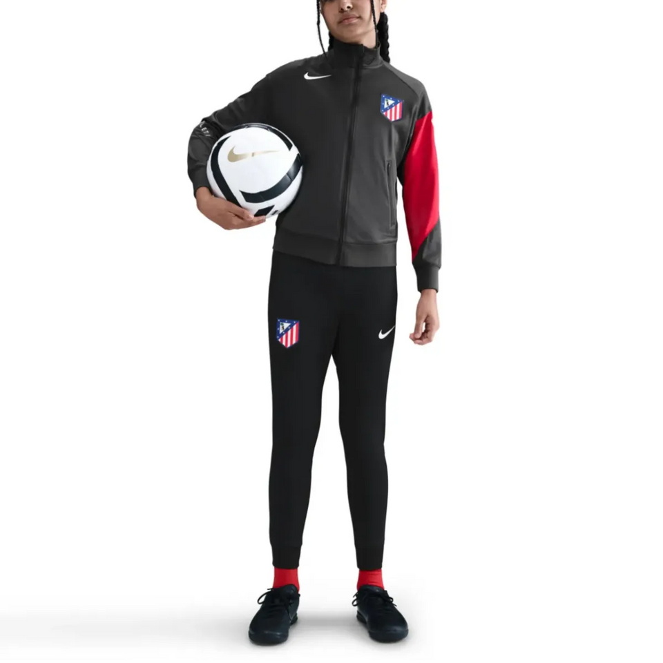 Kids Atletico Madrid Nike tracksuit 2025 2026 in black and red, perfect for young soccer fans