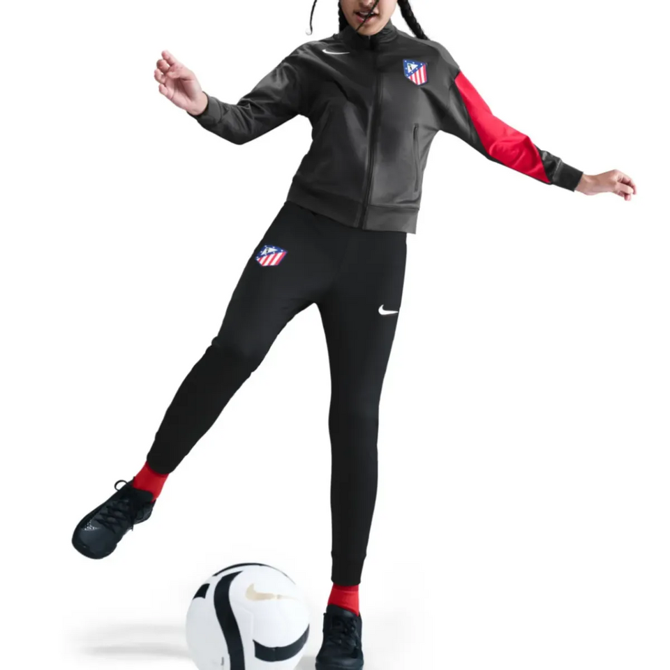 Kids Atletico Madrid Nike tracksuit 2025 2026 in black and red with stylish design for young soccer fans