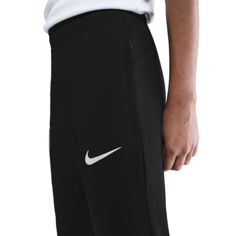 Close-up of kids Atletico Madrid Nike tracksuit 2025 2026 featuring sleek black design and Nike logo