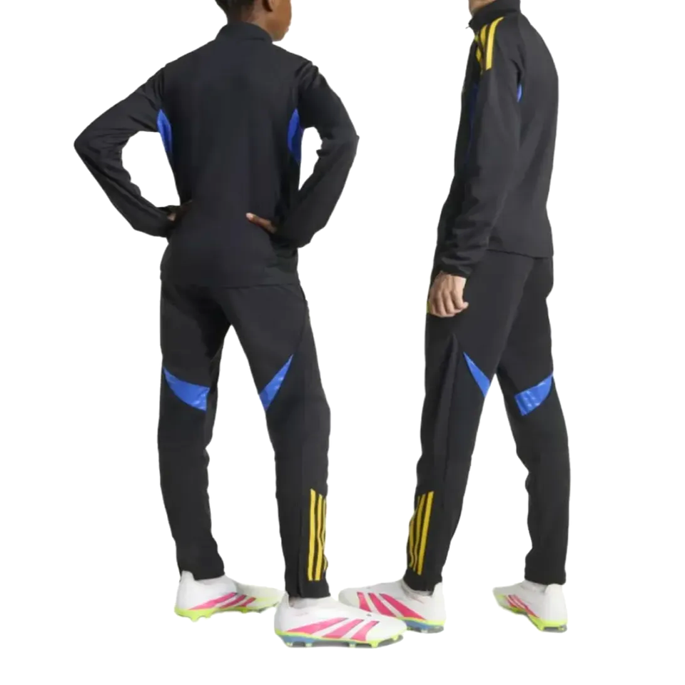 Kids Manchester United UCL training tracksuit 2025 available in black with blue accents for young fans