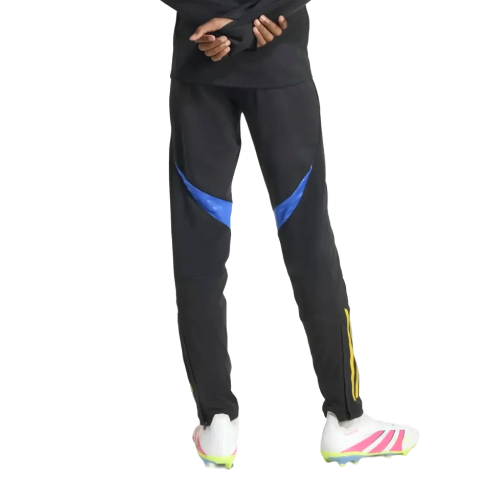 Kids Manchester United UCL training tracksuit 2025 featuring black pants with blue accents for young fans