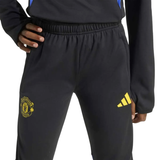Kids Manchester United UCL training tracksuit 2025 with black pants and yellow logo for young fans