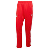 Red Adidas x Liverpool FC tracksuit pants with white stripes on a light gray background