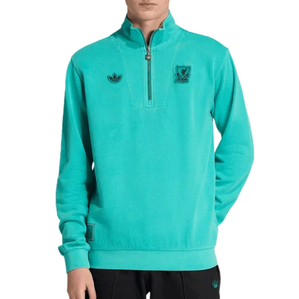 Teal Adidas x Liverpool FC pullover with brand logo on a white background