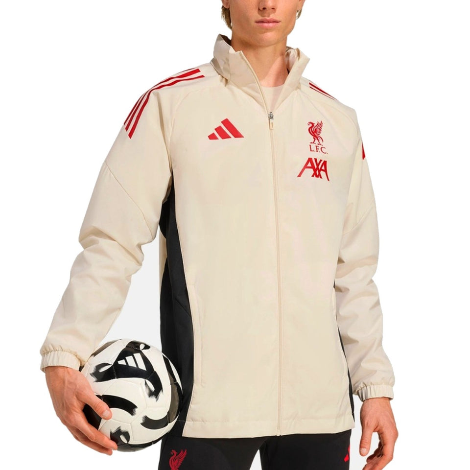 Liverpool FC training rain jacket 2025 in beige with Adidas logo and side stripes on SoccerTracksuits.com
