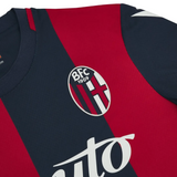 Bologna FC home jersey 2024 25 close up red and navy vertical stripes with BFC 1909 crest and sponsor logo
