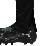 Close-up of a player wearing the Manchester City black training tracksuit 2025 with stylish Puma soccer cleats