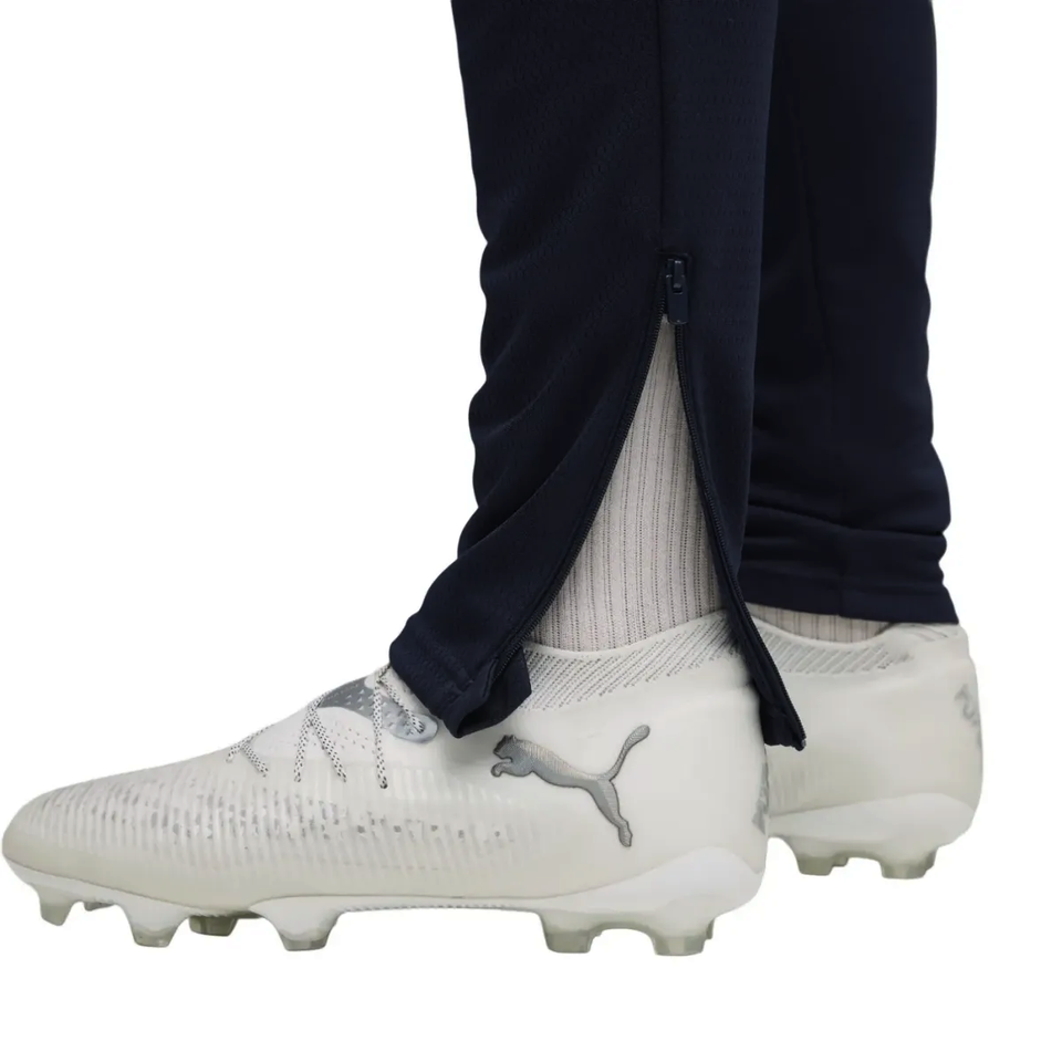 Close-up of Manchester City training tracksuit 2025 26 featuring zipper at ankle and Puma on SoccerTracksuits.com