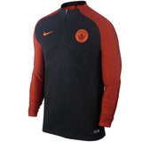 Manchester City Vaporknit training top in black and orange for optimal performance and comfort on SoccerTracksuits.com