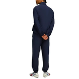 Back view of a man in a navy Manchester City woven tracksuit 2025 26, perfect for training and casual wear