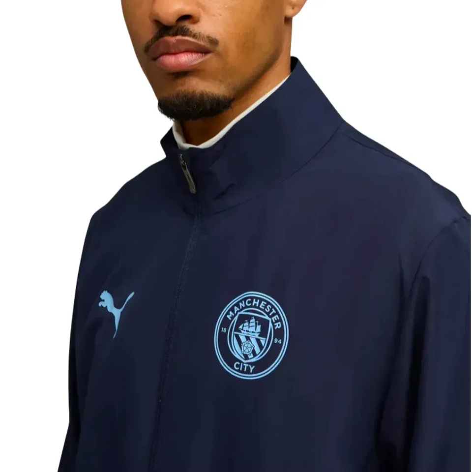 Stylish Manchester City woven tracksuit 2025 26 featuring a navy design and logo detail