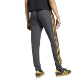 Manchester United Adidas Originals tracksuit featuring stylish gray pants with yellow stripes