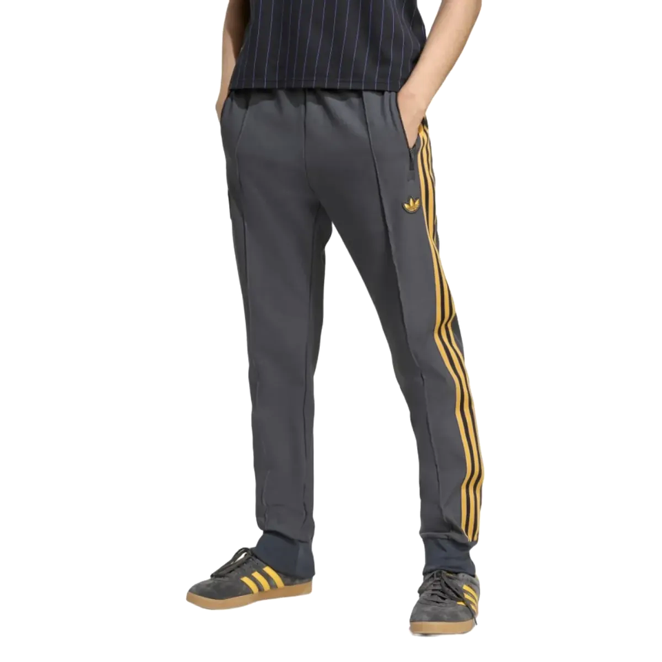Manchester United Adidas Originals tracksuit pants featuring iconic three stripes and comfortable fit