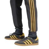 Manchester United Adidas Originals tracksuit with stylish grey and yellow accents for soccer enthusiasts