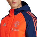Manchester United Adidas parka jacket featuring vibrant colors and team logo for fans