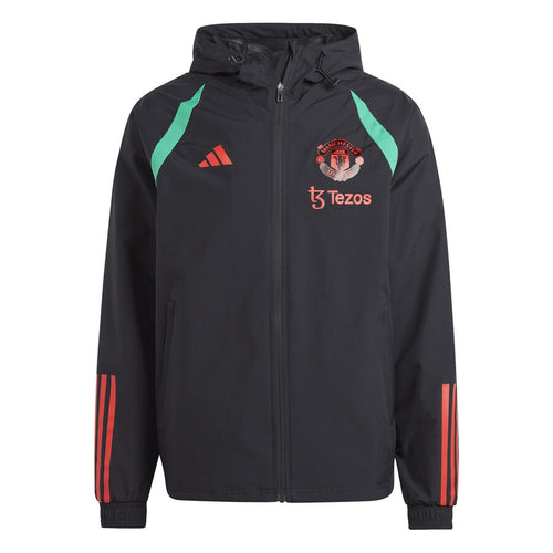 Manchester United black rain jacket 2023 with teal accents and red logos on SoccerTracksuits.com