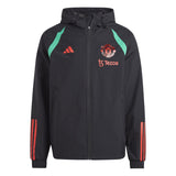 Manchester United black rain jacket 2023 with teal accents and red logos on SoccerTracksuits.com
