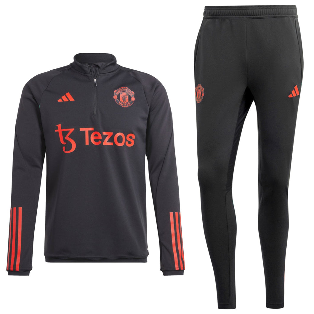 Manchester United black training tracksuit 2023 featuring logo and red accents for fans and athletes