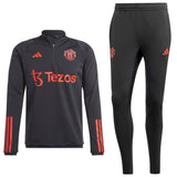 Manchester United black training tracksuit 2023 featuring logo and red accents for fans and athletes