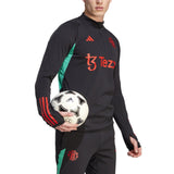 Mens Manchester United black training tracksuit 2023 with green and red accents, ideal for soccer training