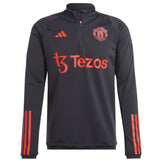 Manchester United black training tracksuit 2023 with quarter zip and red accents for team support