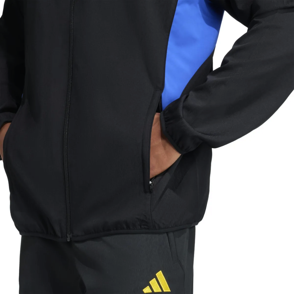 Manchester United black UCL tracksuit 2025 featuring a stylish design with blue accents