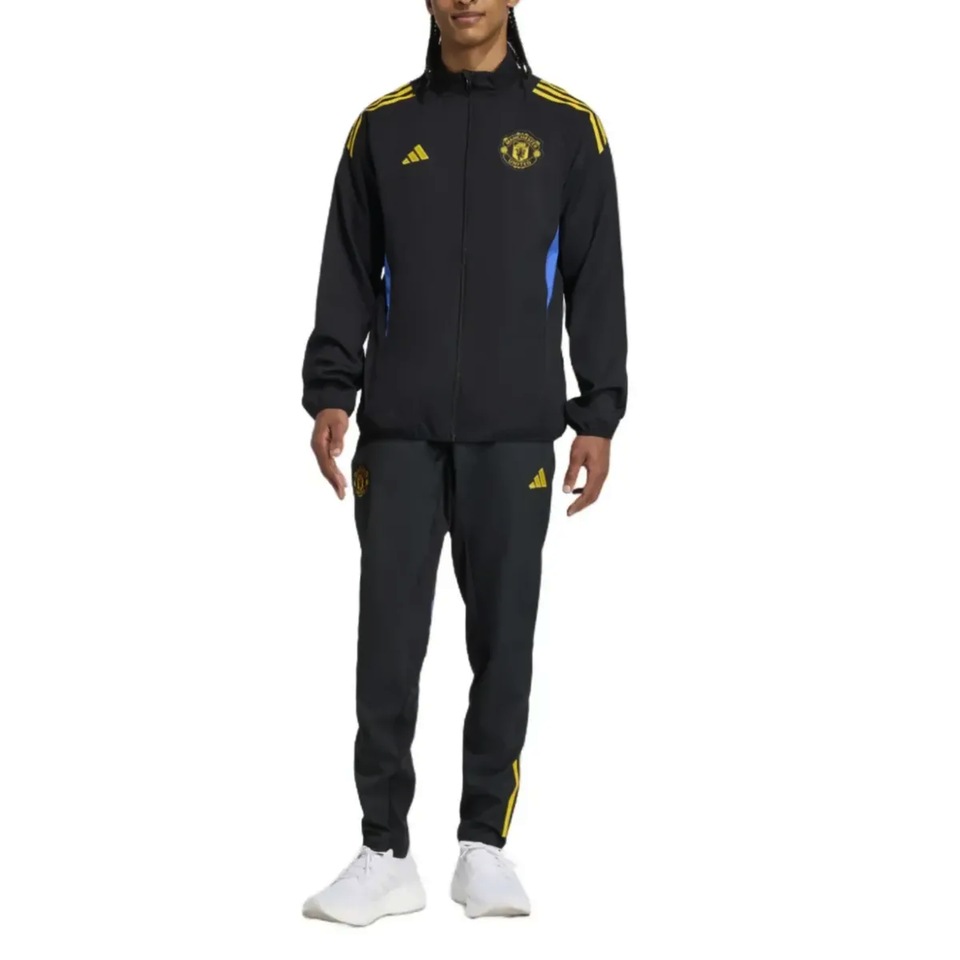 Manchester United black UCL tracksuit 2025 featuring a zip-up jacket and matching pants in a stylish design