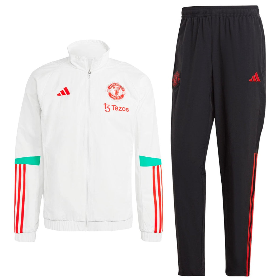 Manchester United presentation tracksuit 2023 featuring a white jacket and black pants with red accents