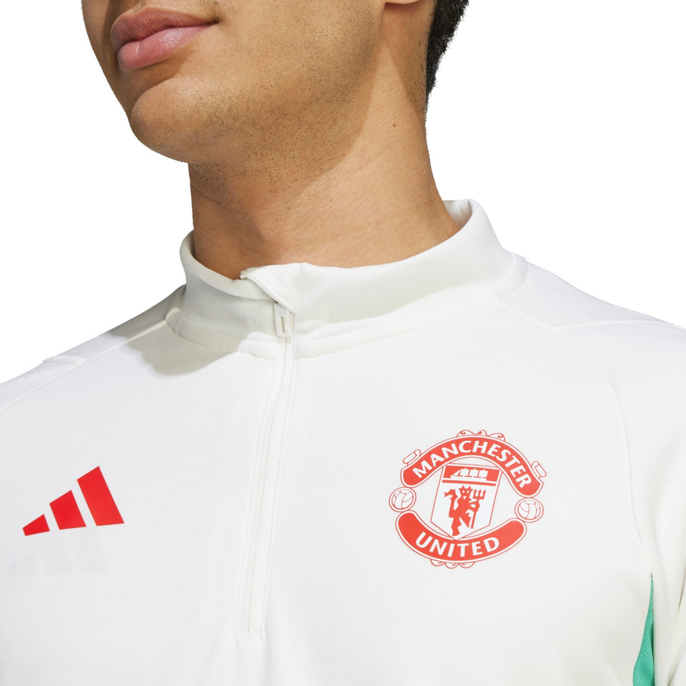 Manchester United training tracksuit 2023 24 featuring the club logo in vibrant colors