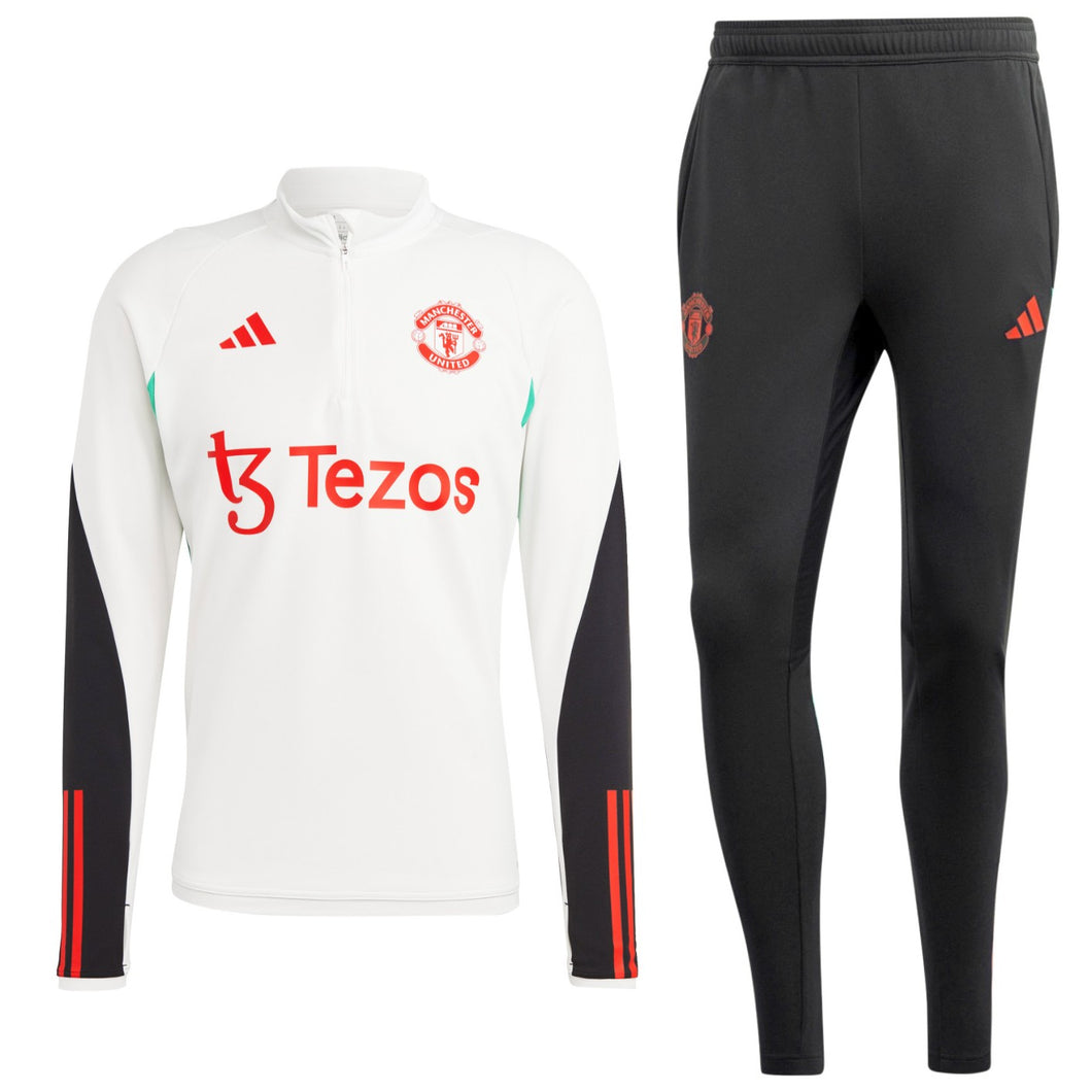 Manchester United training tracksuit 2023 24 featuring a white zip-up top and black pants