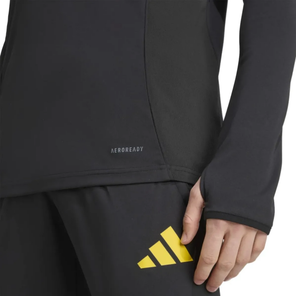 Close-up of the black Adidas Manchester United UCL training tracksuit 2025 26 featuring Aeroready fabric