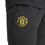 Manchester United UCL training tracksuit 2025 26 featuring the iconic club logo on pants