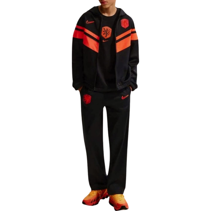 Kids Netherlands 2026/27 casual presentation soccer tracksuit 2026/27 by Nike in black with orange accents and logo