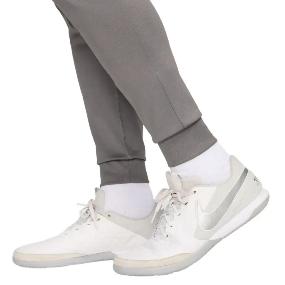 Atletico Madrid soccer tracksuit for sale shown with gray pants and white Nike shoes